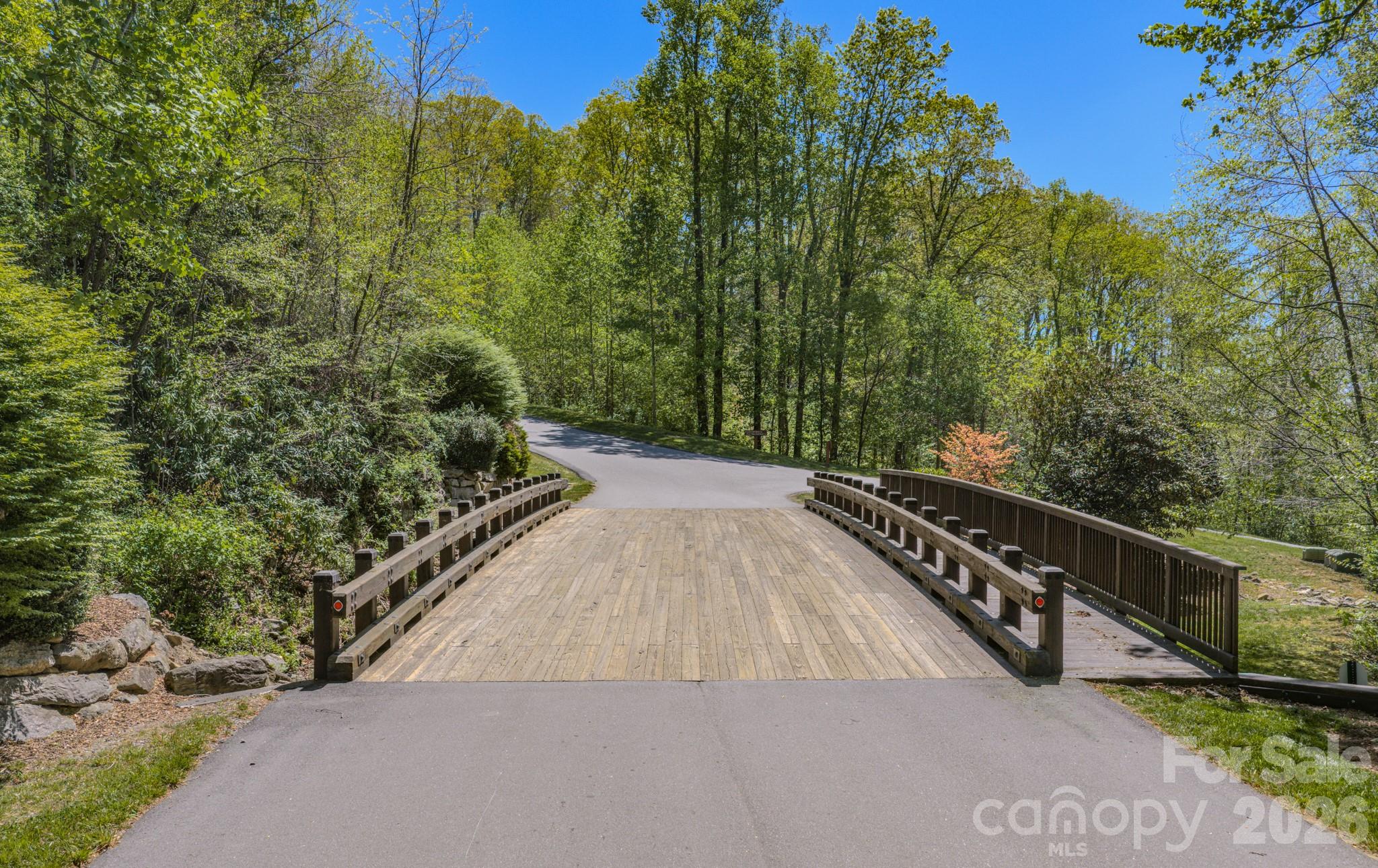 67 Clear Water Trail Road, Unit 511 Fairview, NC 28730 - Photo 4 of 12 a view of a wooden bridge