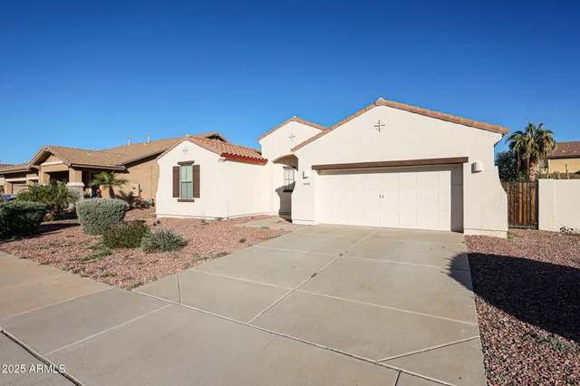 a front view of a house with a garage