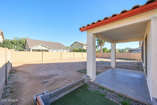 a view of a house with backyard and porch