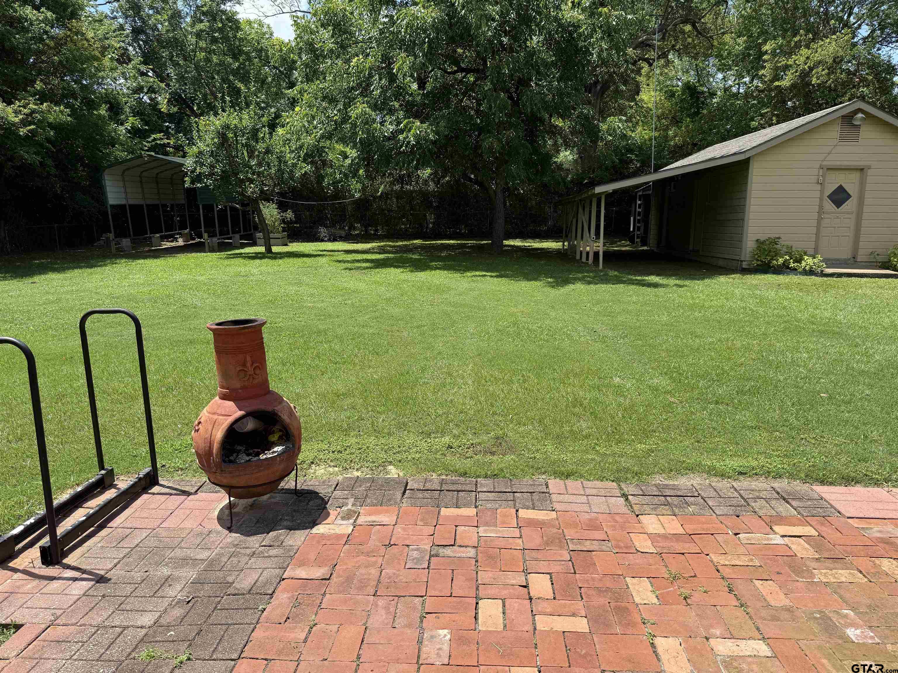 2015 East 5th Street Tyler, TX 75701 - Photo 25 of 32 a backyard of a house with barbeque oven