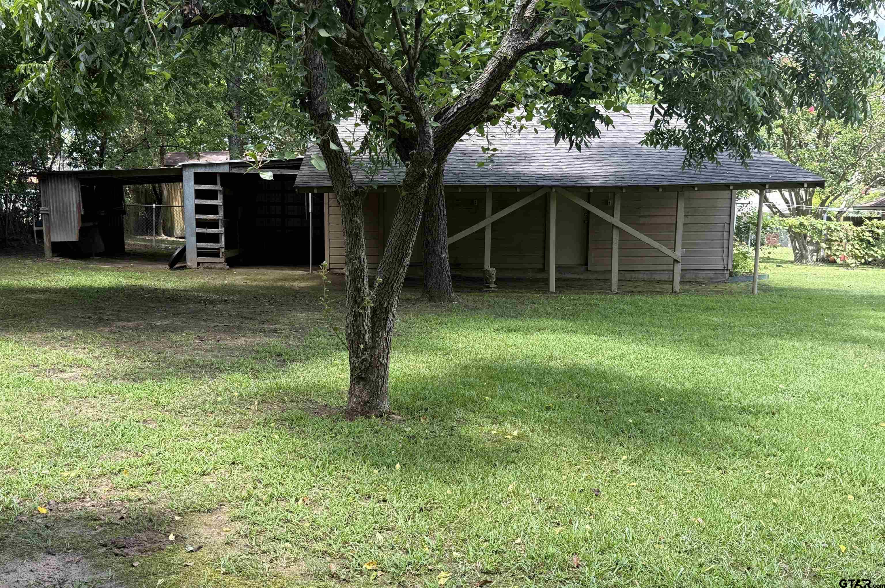 2015 East 5th Street Tyler, TX 75701 - Photo 26 of 32 a view of a house with a yard