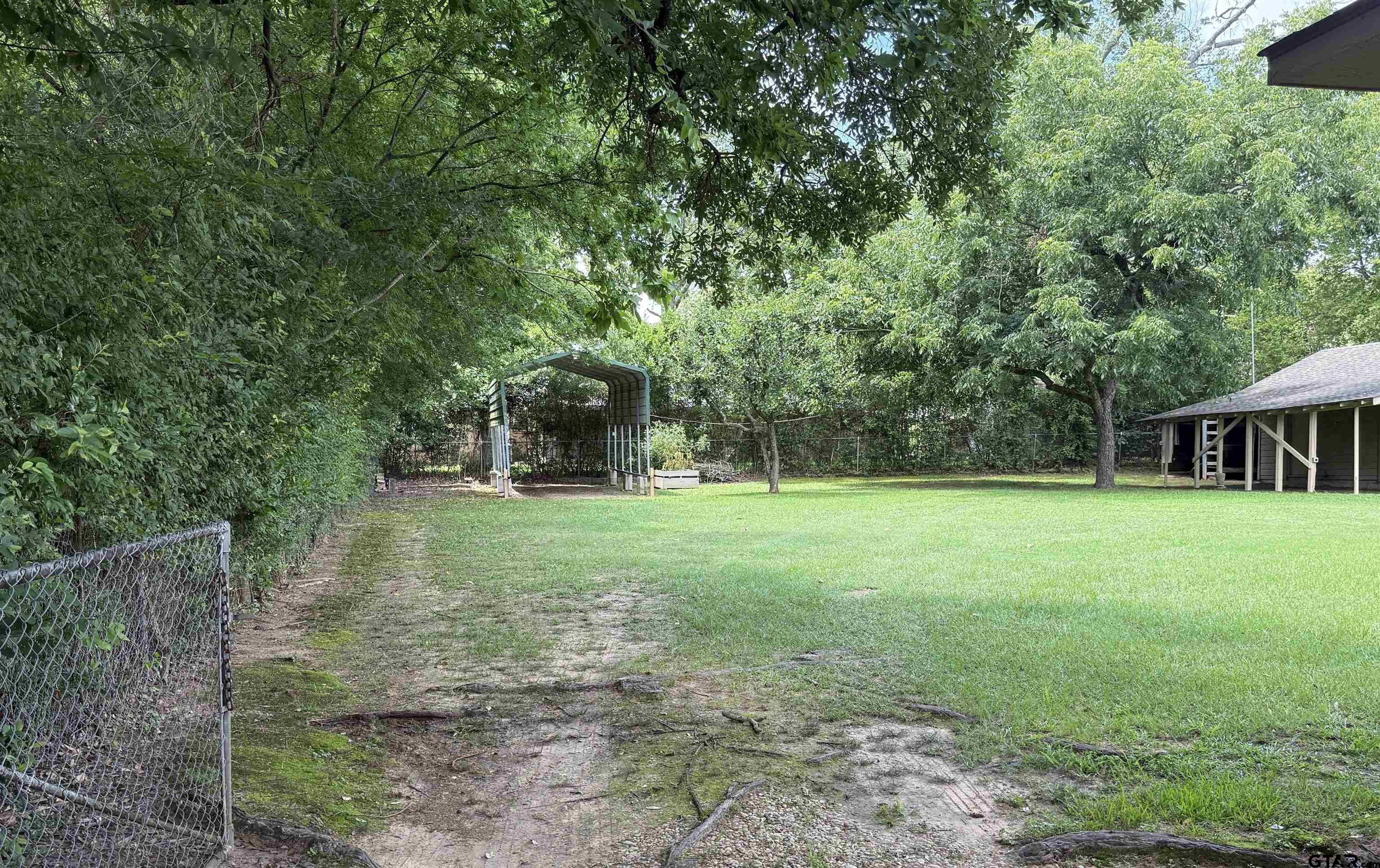 2015 East 5th Street Tyler, TX 75701 - Photo 31 of 32 a view of a house with a backyard