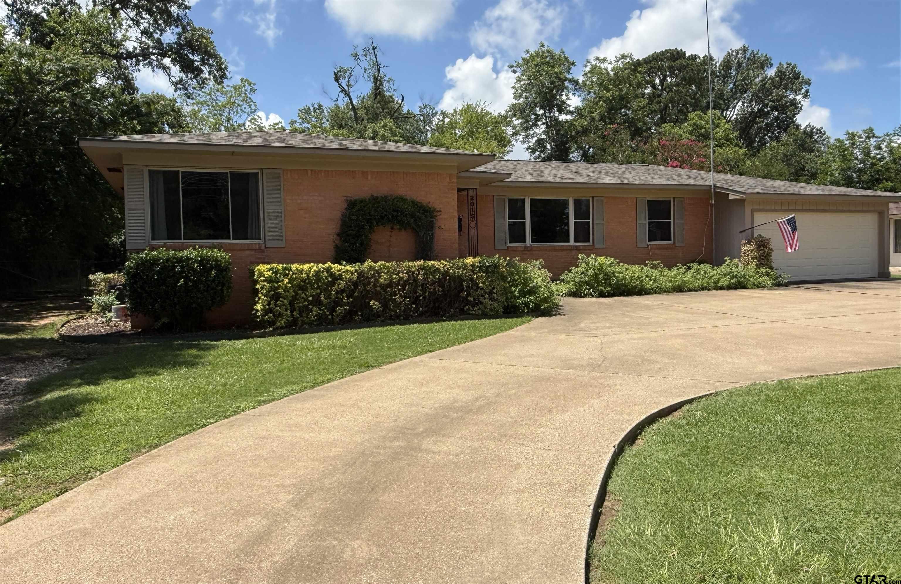 2015 East 5th Street Tyler, TX 75701 - Photo 32 of 32 a front view of house with yard and green space