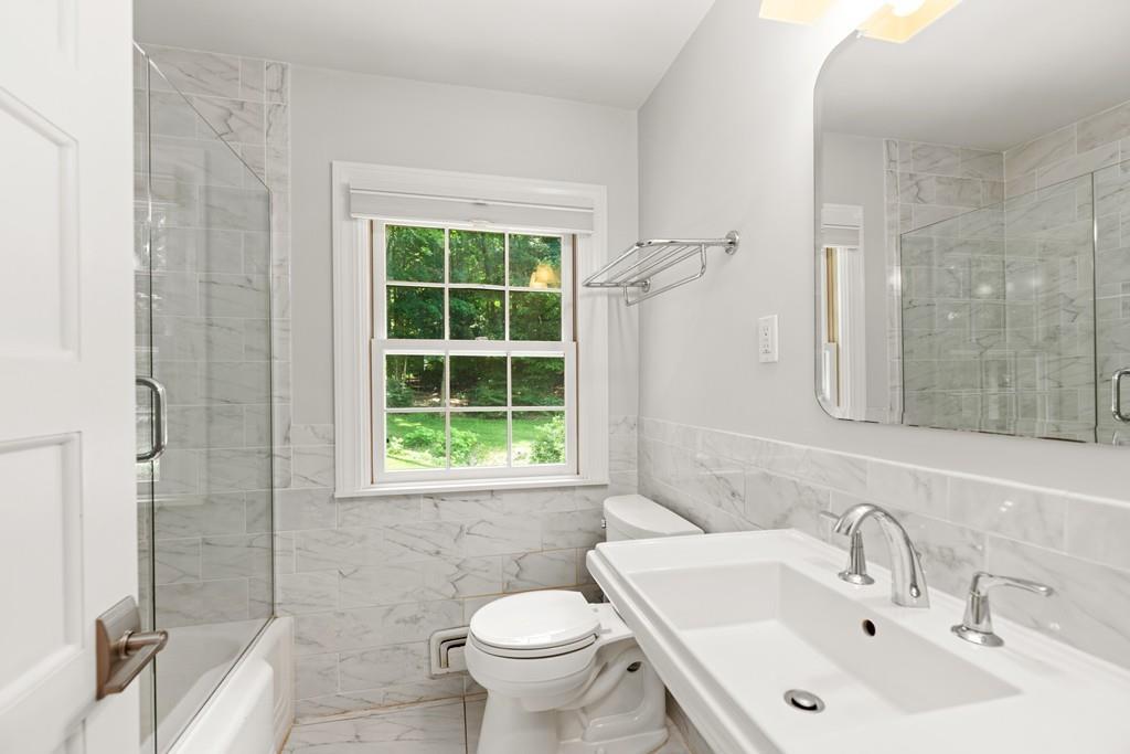 20 Cliff Road Wellesley, MA 02481 - Photo 12 of 21 a bathroom with a sink toilet and shower