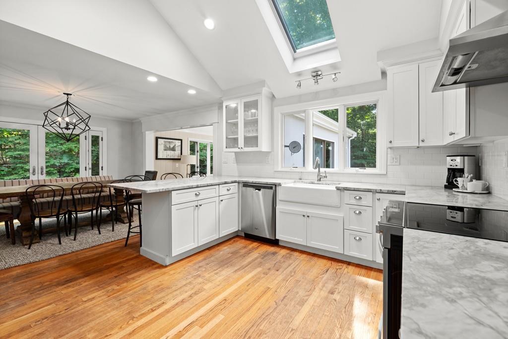 20 Cliff Road Wellesley, MA 02481 - Photo 6 of 21 a kitchen with white cabinets appliances and a window