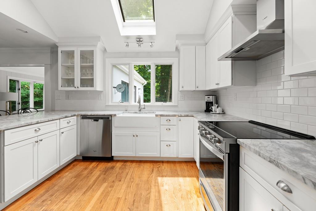 20 Cliff Road Wellesley, MA 02481 - Photo 7 of 21 a kitchen with granite countertop a sink stainless steel appliances and cabinets