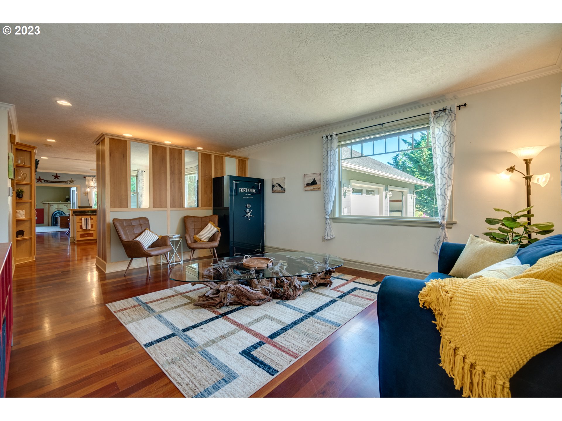 1675 South Boones Ferry Road Woodburn, OR 97071 - Photo 12 of 45 a living room with furniture a dining table and a large window