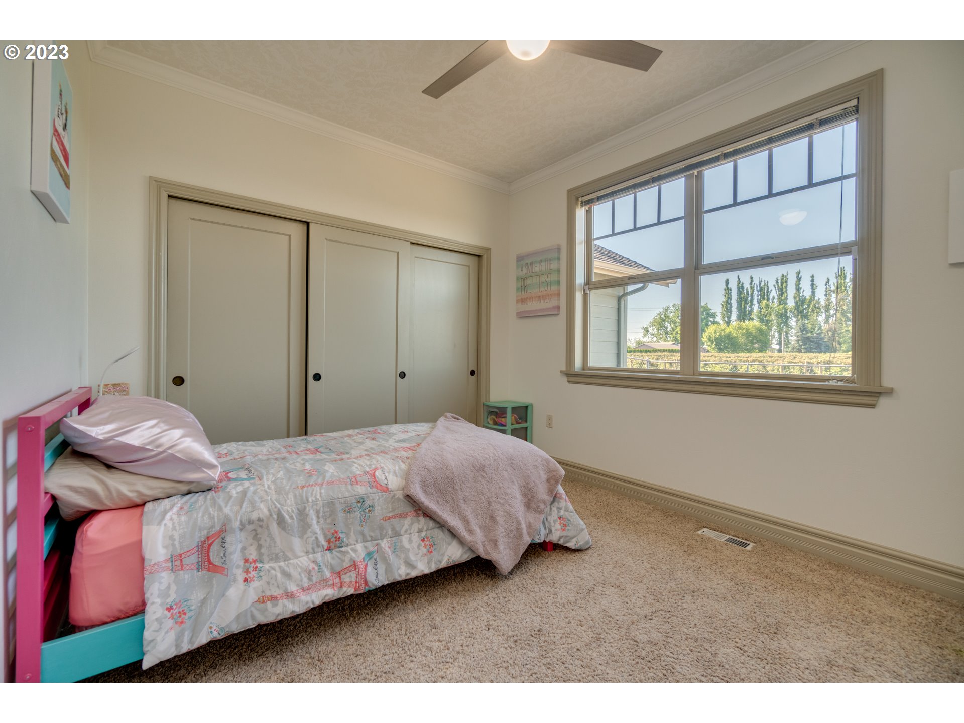 1675 South Boones Ferry Road Woodburn, OR 97071 - Photo 22 of 45 a bedroom with a bed and window