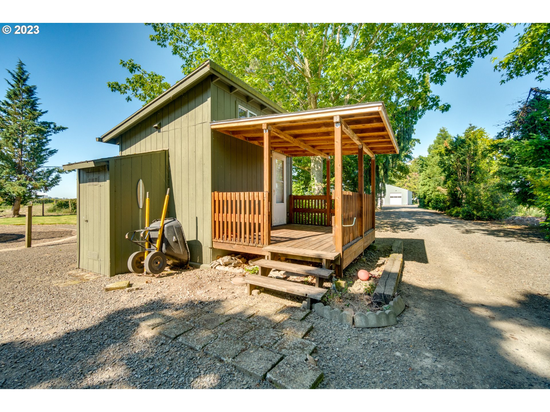 1675 South Boones Ferry Road Woodburn, OR 97071 - Photo 36 of 45 a backyard of a house with table and chairs