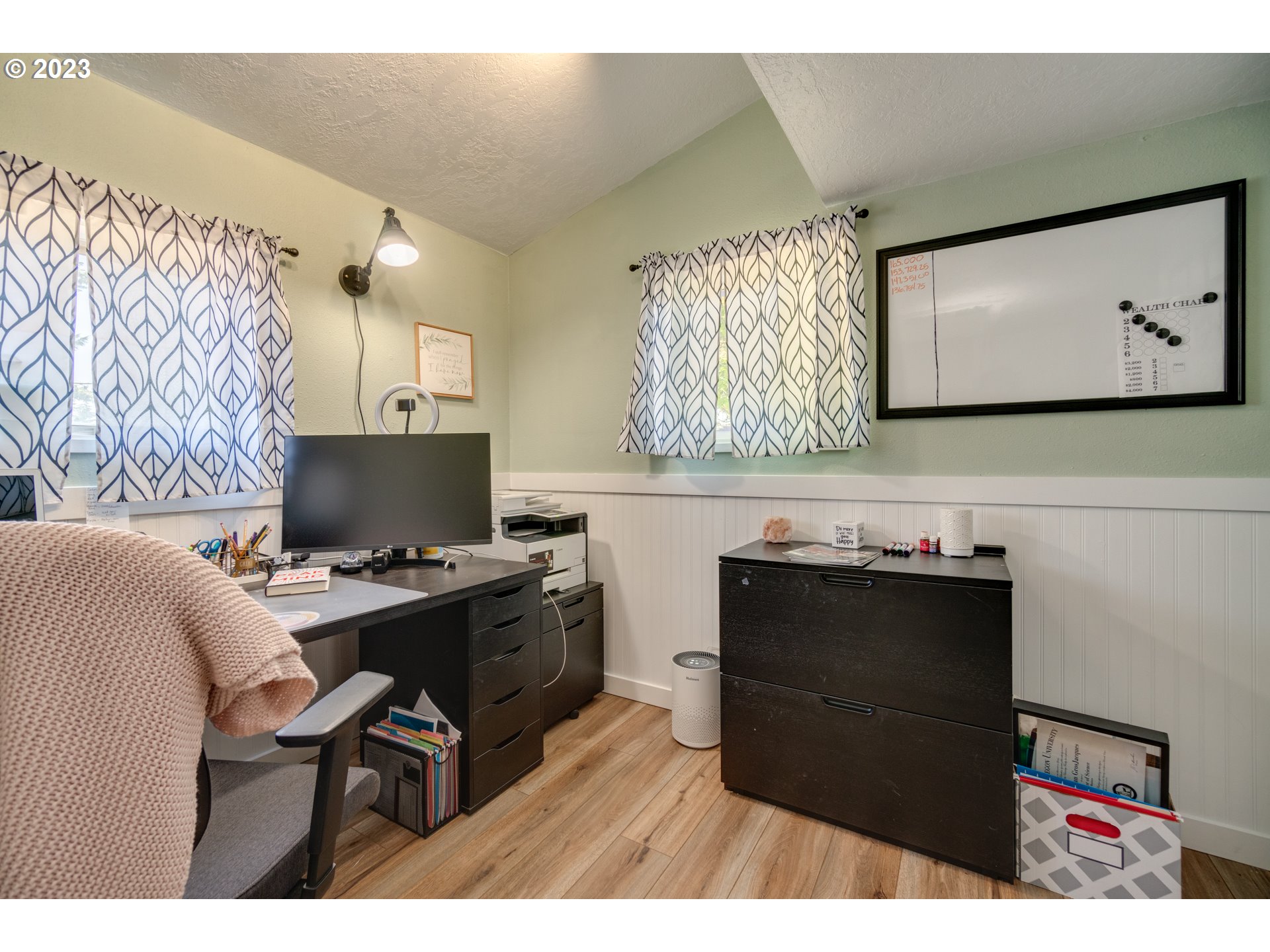 1675 South Boones Ferry Road Woodburn, OR 97071 - Photo 37 of 45 a living room with furniture and a flat screen tv