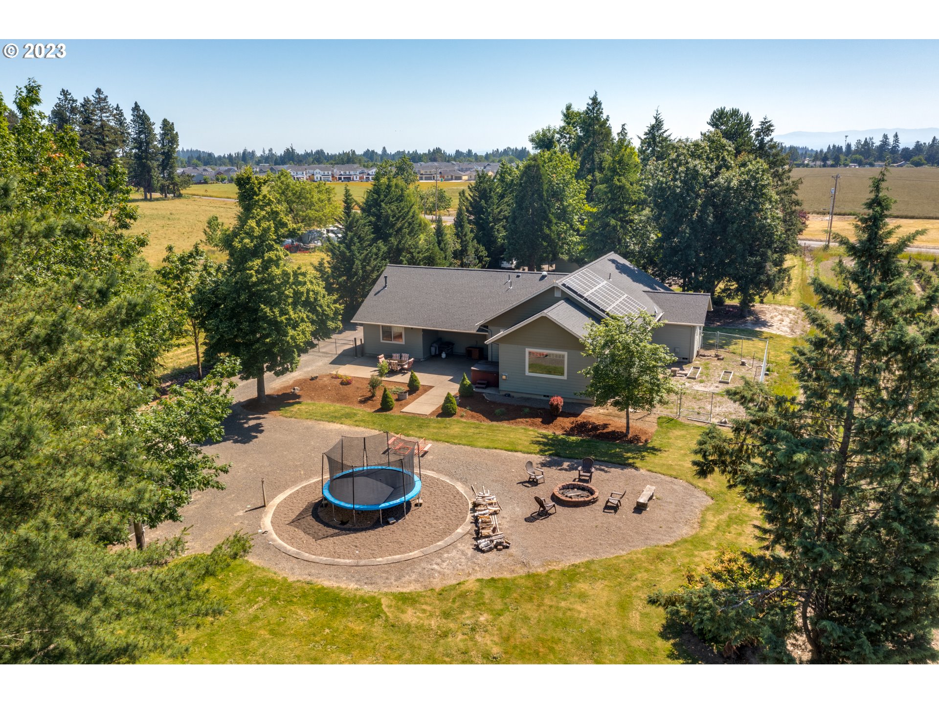 1675 South Boones Ferry Road Woodburn, OR 97071 - Photo 42 of 45 a view of a house with yard and lake view
