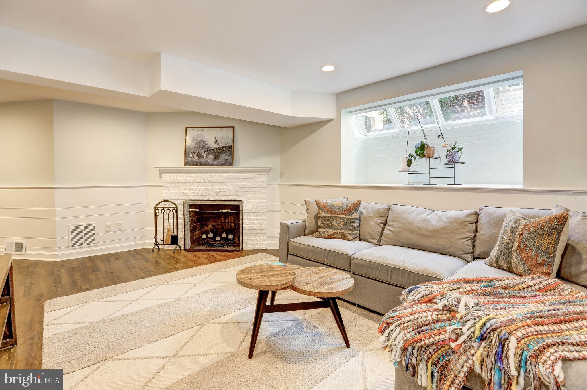 1015 Woodside Parkway Silver Spring, MD 20910 - Photo 47 of 60 Wood burning fire place and loads of natural light