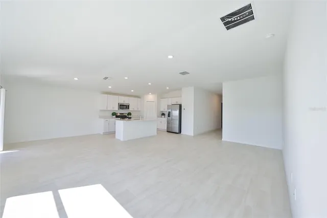 a view of an empty room with a window