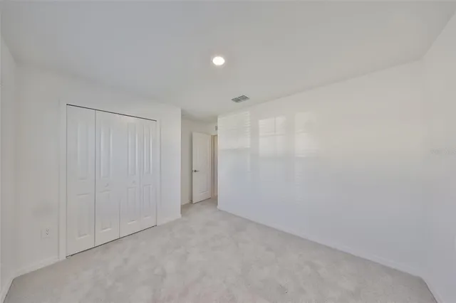 an aerial view of a house with outdoor space