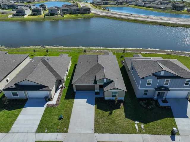 an aerial view of a house with a swimming pool