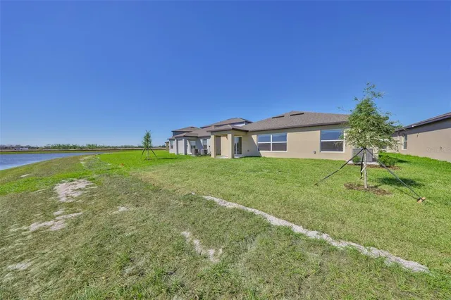 a view of swimming pool with a garden and seating area