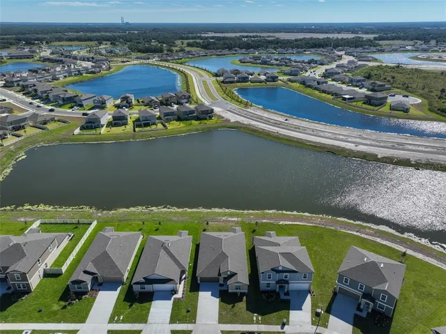 a roof deck with a table and chairs