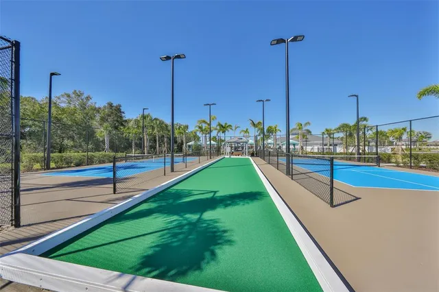 a view of a swimming pool and a yard