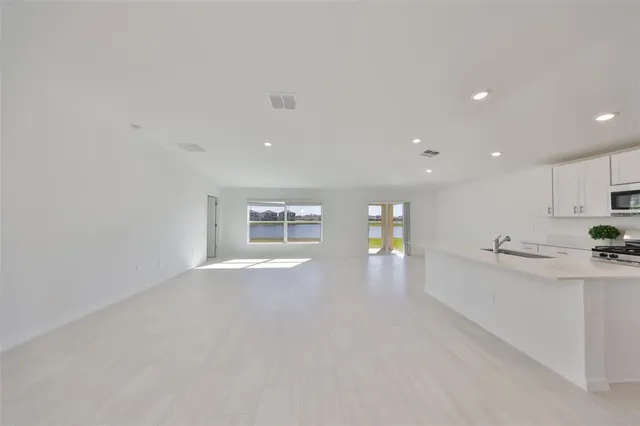 a kitchen with sink cabinets and window