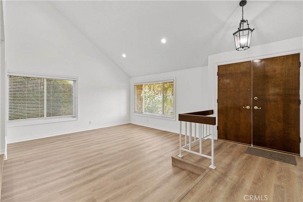 19 Alameda Irvine, CA 92620 - Photo 15 of 55 a view of an empty room with a window and wooden floor