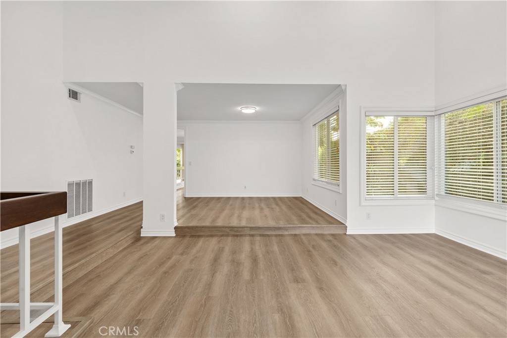 19 Alameda Irvine, CA 92620 - Photo 17 of 55 a view of empty room with wooden floor and fan