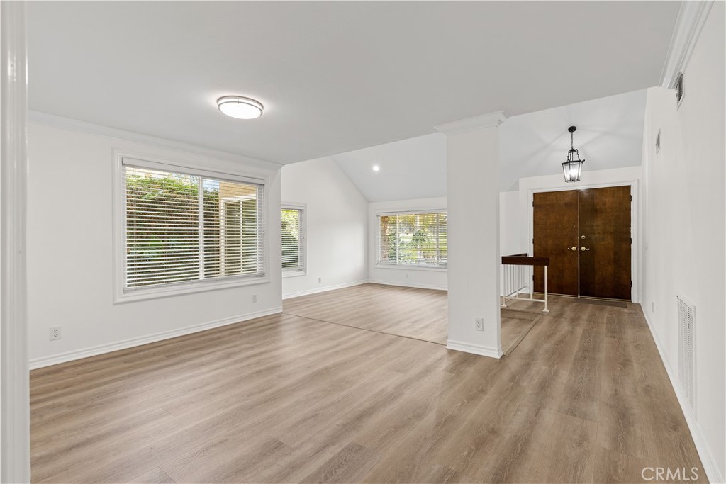 19 Alameda Irvine, CA 92620 - Photo 18 of 55 a view of an empty room with a window and wooden floor