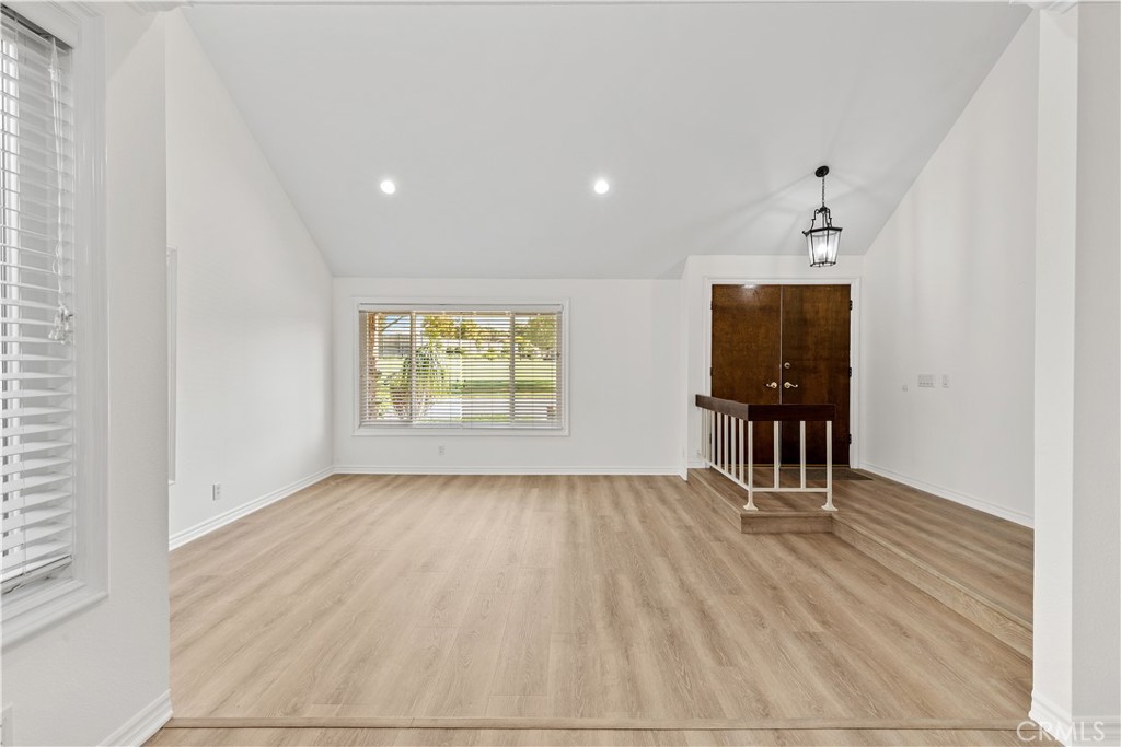 19 Alameda Irvine, CA 92620 - Photo 19 of 55 an empty room with wooden floor and a window