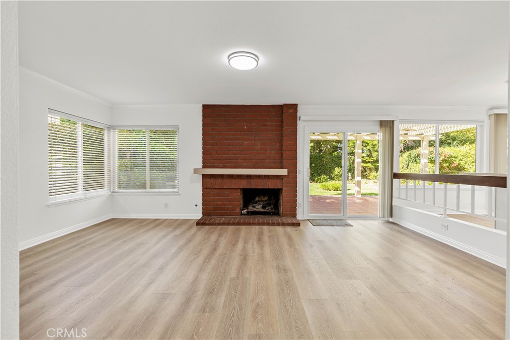 19 Alameda Irvine, CA 92620 - Photo 28 of 55 a view of an empty room with wooden floor and a window