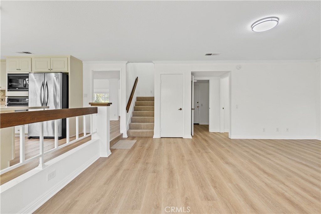 19 Alameda Irvine, CA 92620 - Photo 31 of 55 a view of a room with wooden floor and stairs