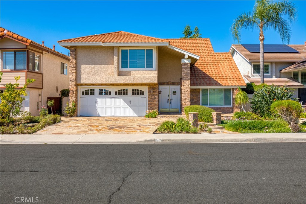 19 Alameda Irvine, CA 92620 - Photo 4 of 55 a front view of a house with a yard