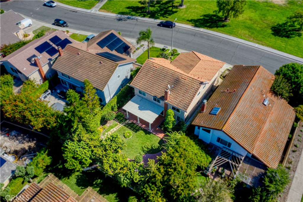 19 Alameda Irvine, CA 92620 - Photo 7 of 55 an aerial view of a house with a yard and garden