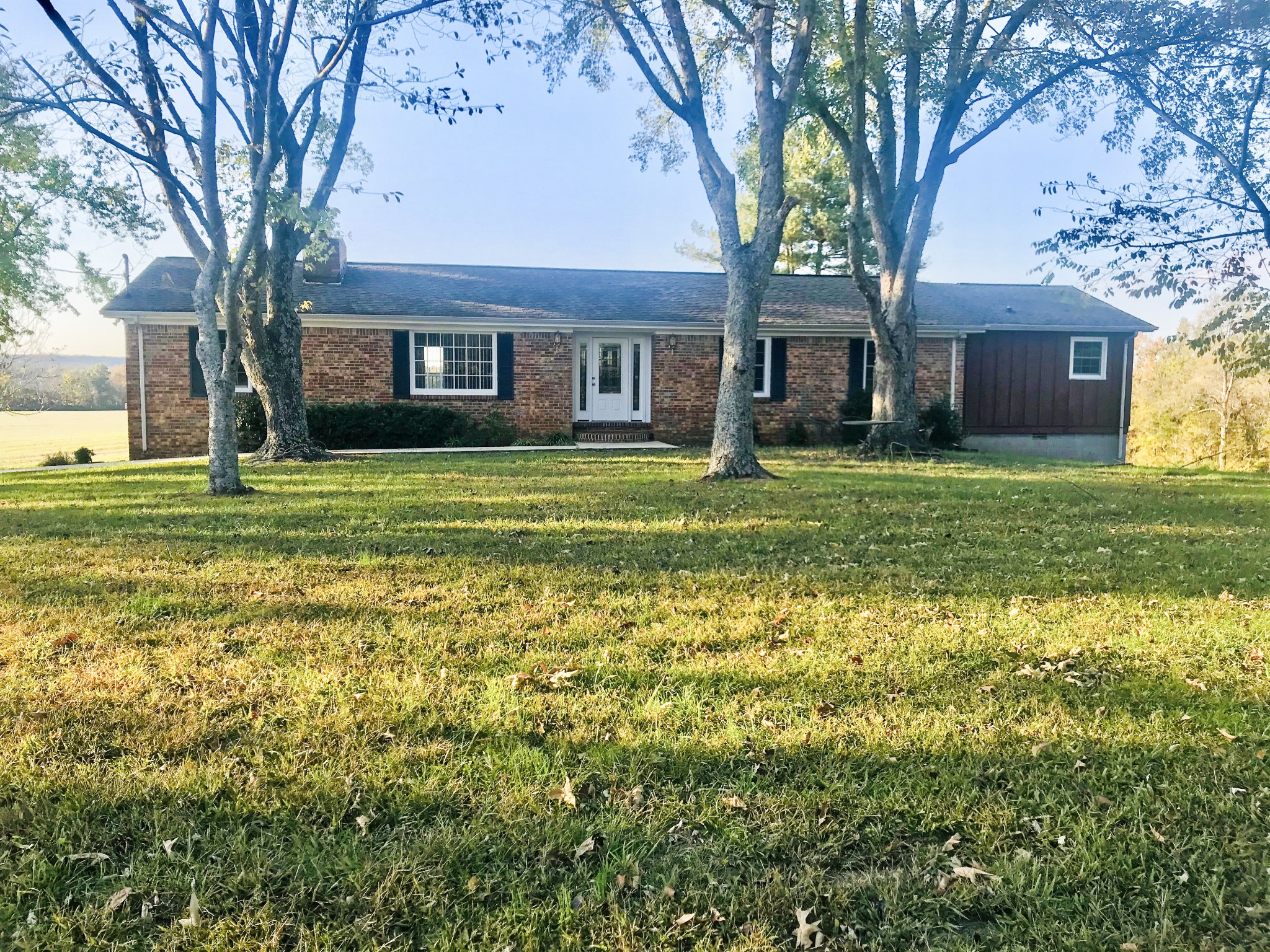 1071 Hills Trace Road Morrison, TN 37357 - Photo 1 of 3 a brick house with trees in front of it