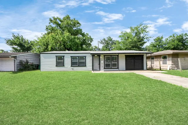front view of a house and a yard