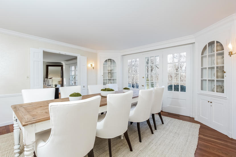 40 Allwood Road Darien, CT 06820 - Photo 15 of 50 a view of a dining room with furniture window and wooden floor
