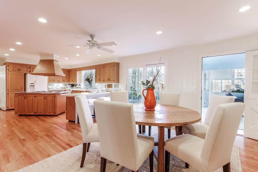 40 Allwood Road Darien, CT 06820 - Photo 16 of 50 a view of a dining room with furniture a kitchen and chandelier