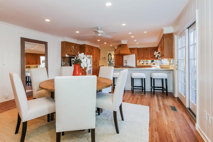40 Allwood Road Darien, CT 06820 - Photo 18 of 50 a living room with furniture and a dining table with wooden floor