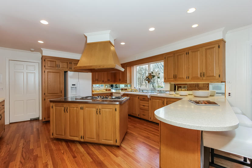 40 Allwood Road Darien, CT 06820 - Photo 19 of 50 a kitchen with stainless steel appliances a sink stove and wooden floor