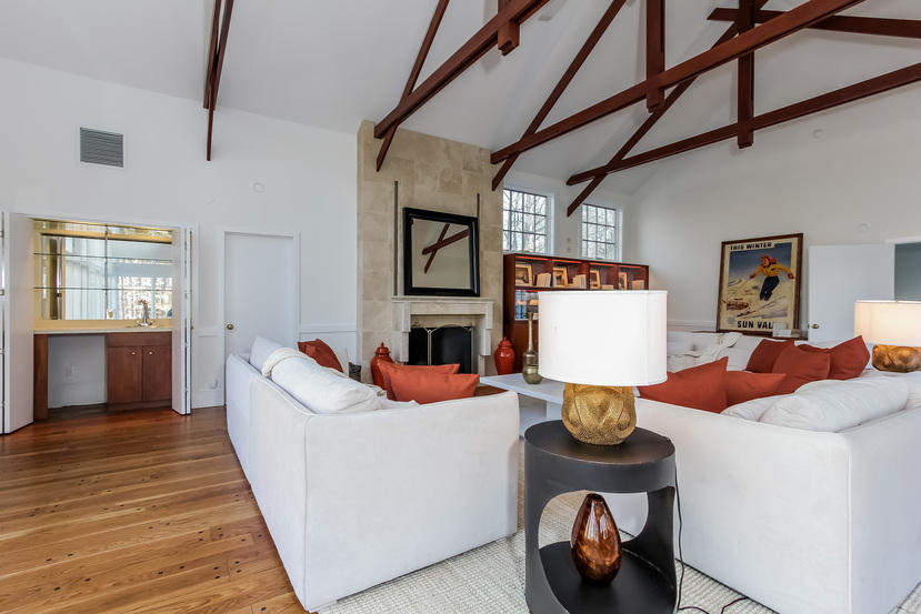 40 Allwood Road Darien, CT 06820 - Photo 23 of 50 a living room with fireplace furniture and a wooden floor