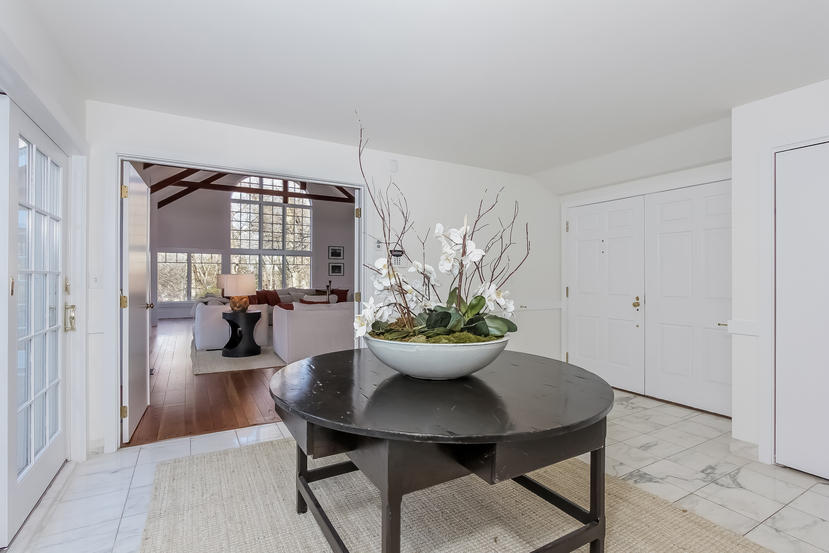 40 Allwood Road Darien, CT 06820 - Photo 27 of 50 a view of a dining room with furniture and a potted plant