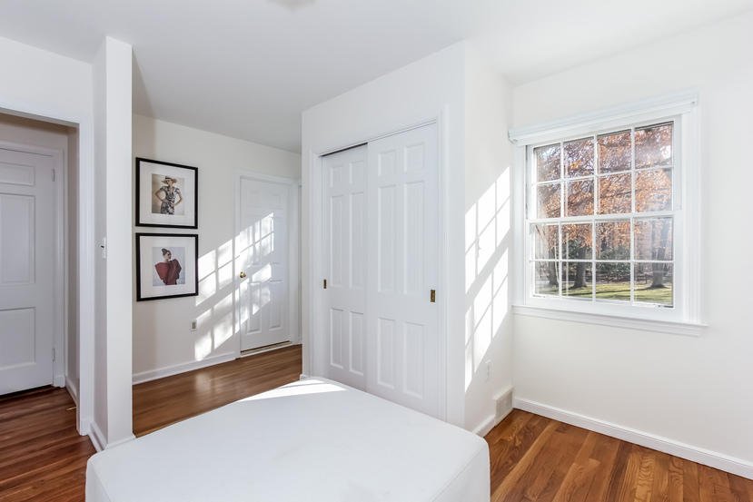 40 Allwood Road Darien, CT 06820 - Photo 36 of 50 a bedroom with a bed and a window with cabinet