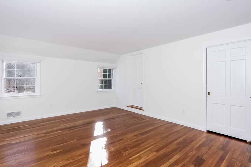 40 Allwood Road Darien, CT 06820 - Photo 39 of 50 an empty room with wooden floor and windows