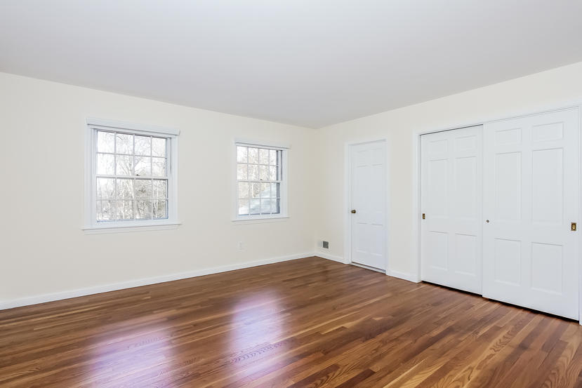 40 Allwood Road Darien, CT 06820 - Photo 41 of 50 an empty room with wooden floor and windows