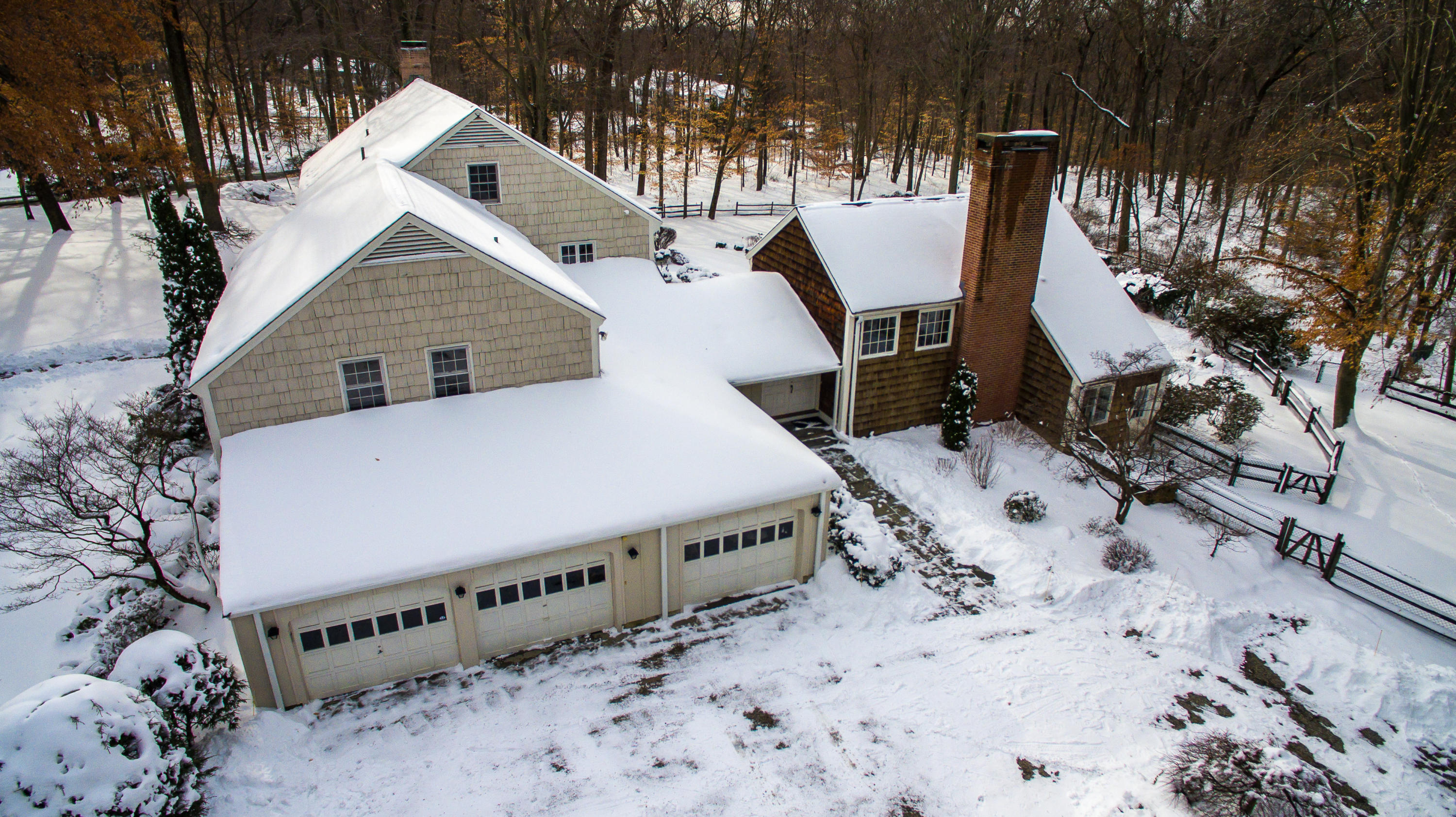 40 Allwood Road Darien, CT 06820 - Photo 49 of 50 a terrace with a table and chairs under an umbrella
