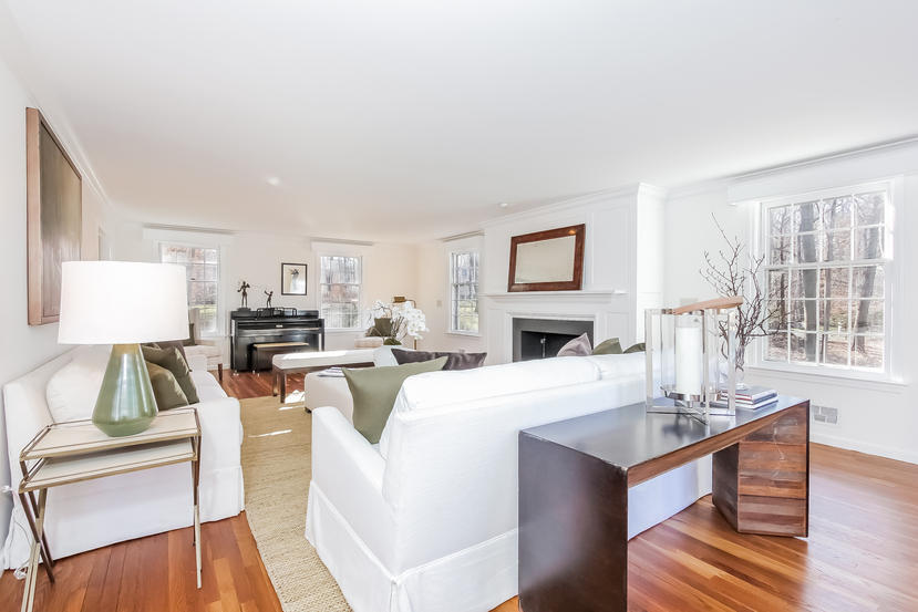 40 Allwood Road Darien, CT 06820 - Photo 8 of 50 a living room with furniture a fireplace and a table