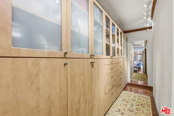 a view of a hallway with windows