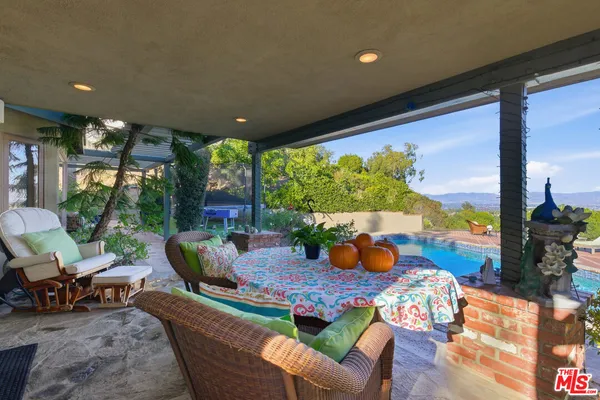 a outdoor living space with furniture and garden view