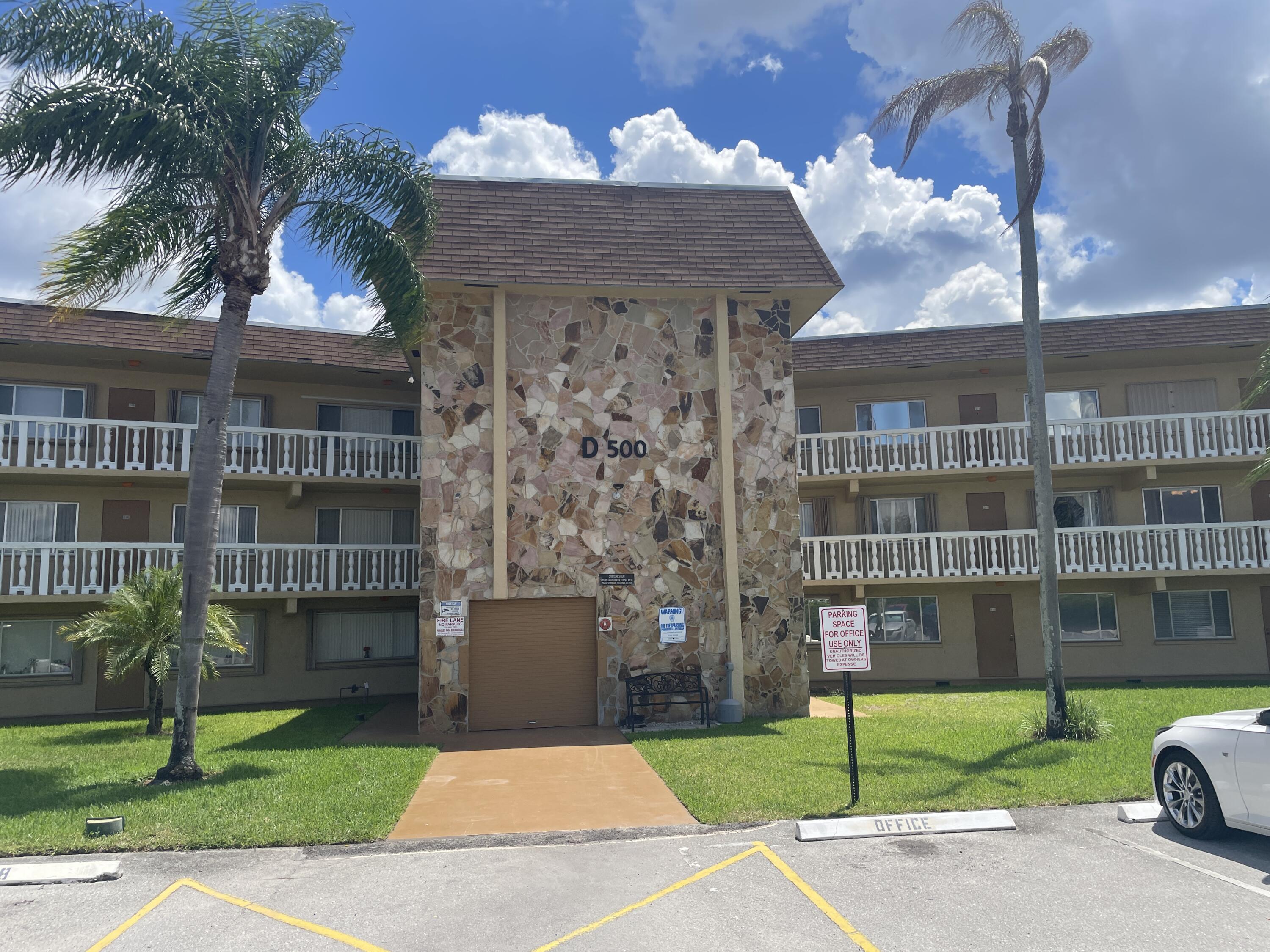 a front view of a building with garden