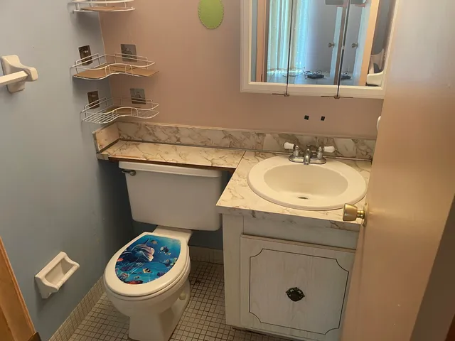 a bathroom with a sink a toilet and a bathtub