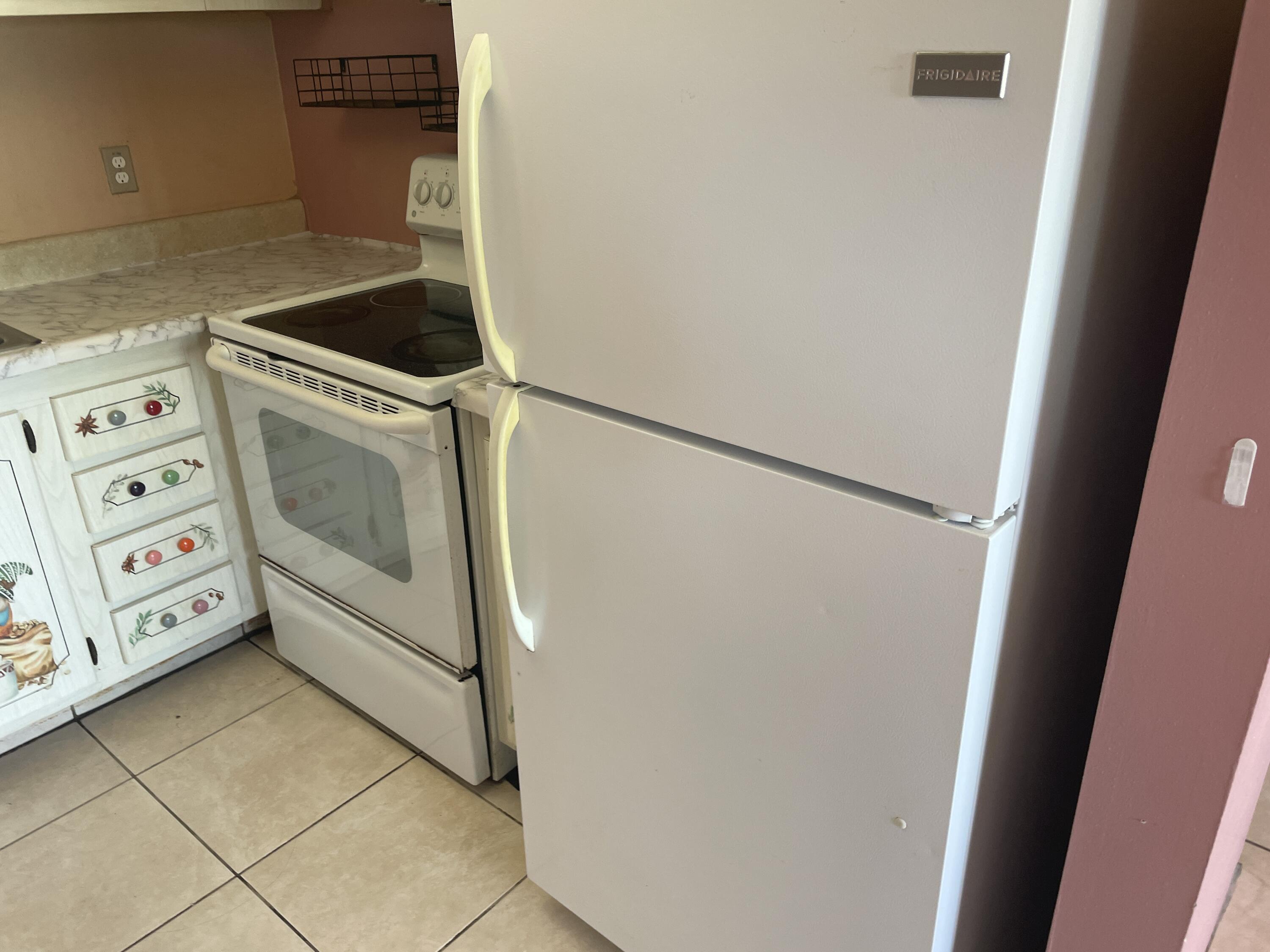 500 Village Green Circle West, Unit 212 Palm Springs, FL 33461 - Photo 3 of 23 a utility room with dryer and washer