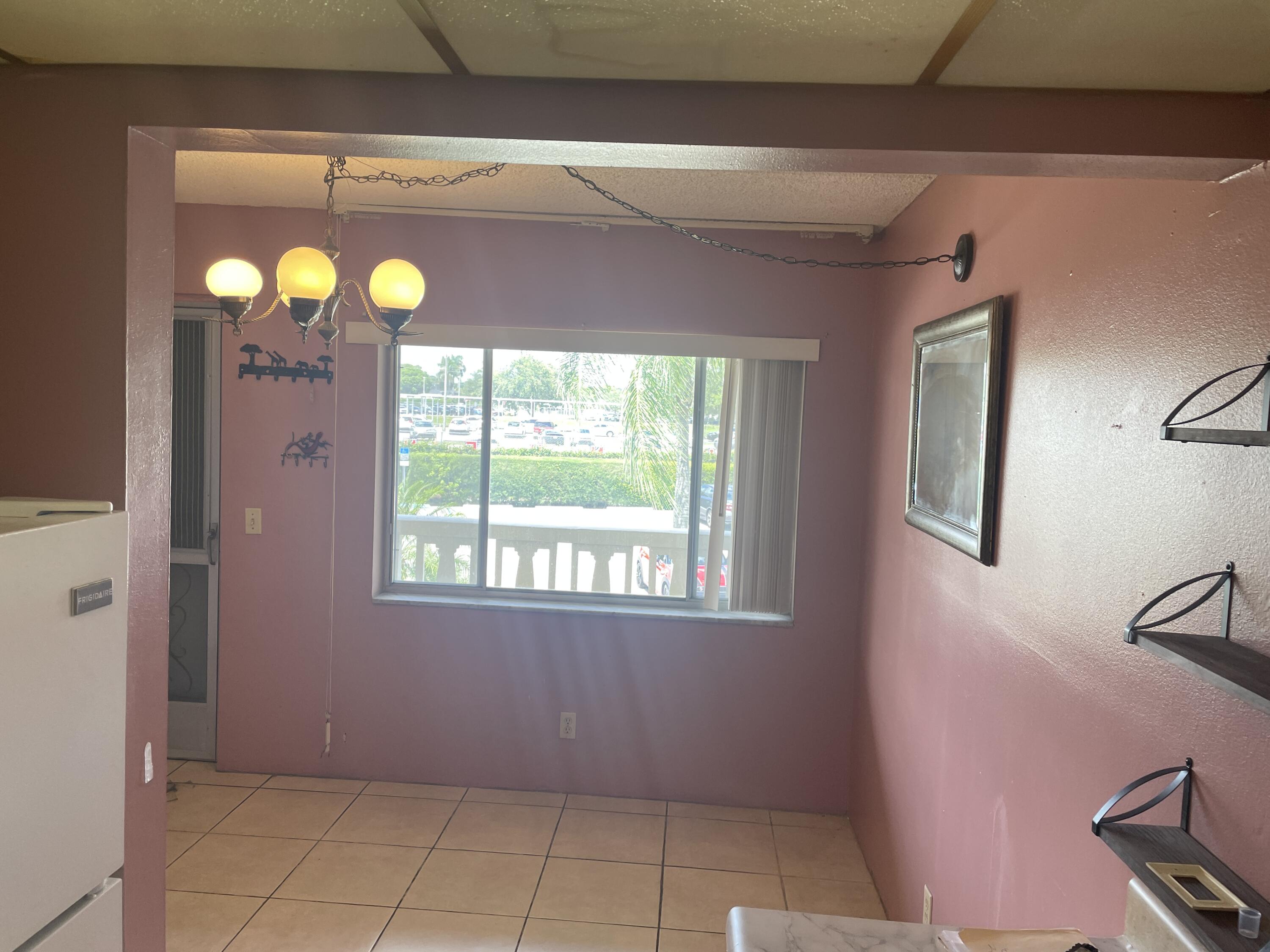 500 Village Green Circle West, Unit 212 Palm Springs, FL 33461 - Photo 6 of 23 a view of empty room with window